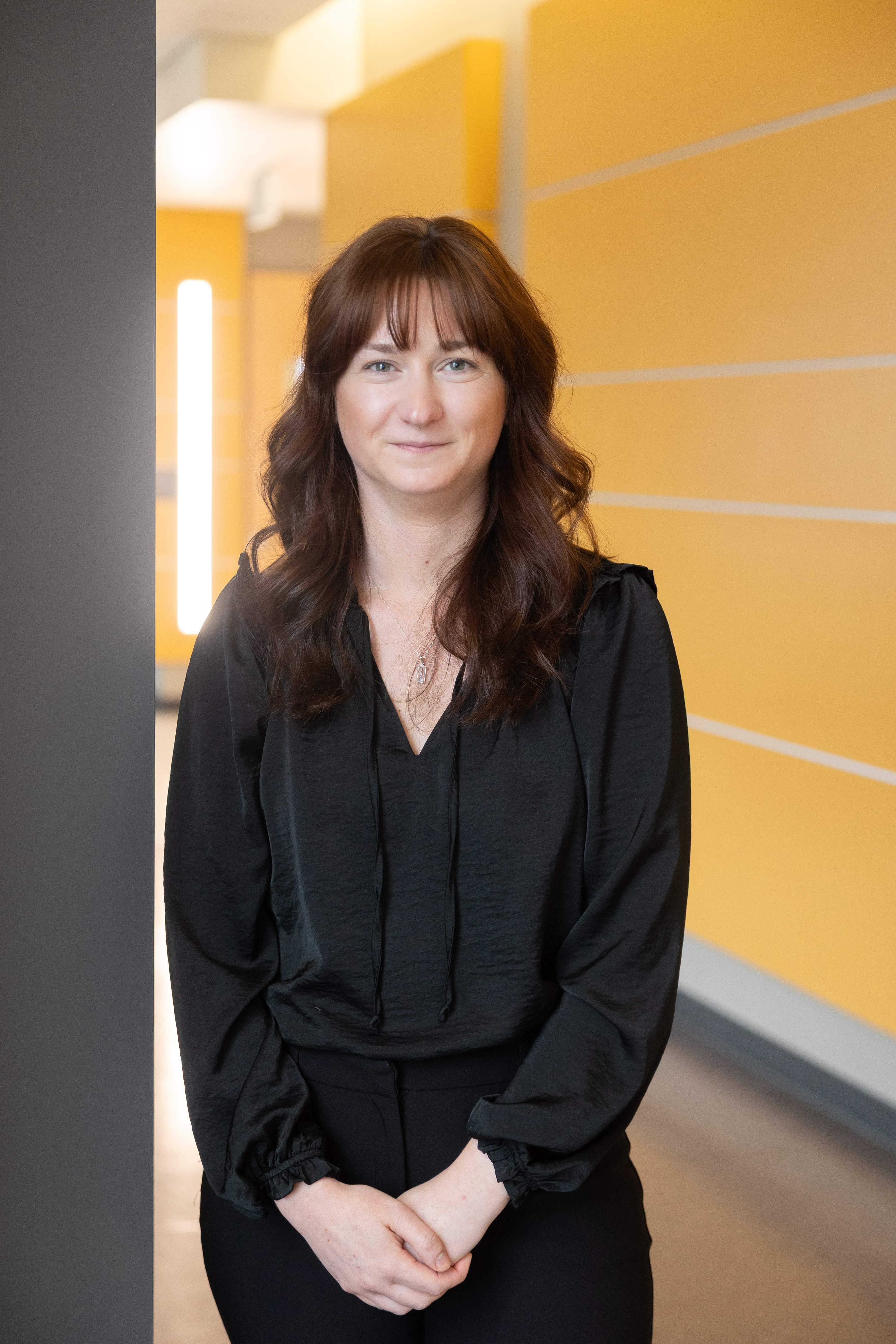 Amanda Marcks portrait in front of gray background.